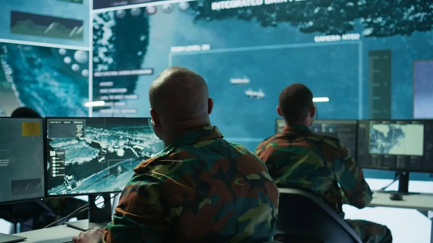 A soldier within a secure environment, ensuring data is analyzed and processed.